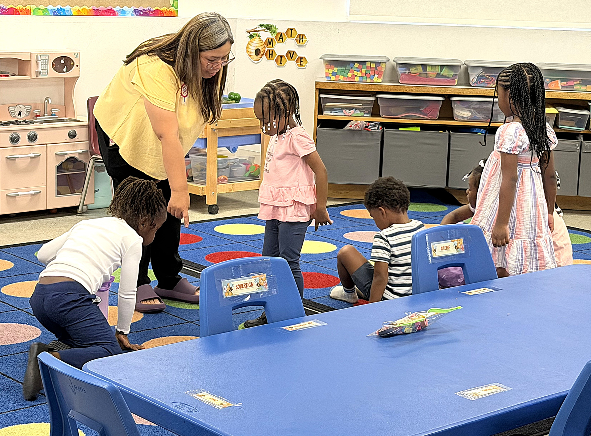 Teacher leading young students